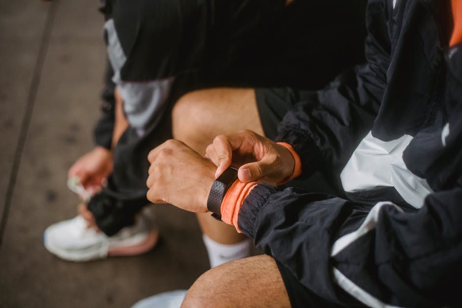 Person adjusting fitness smartwatch during workout